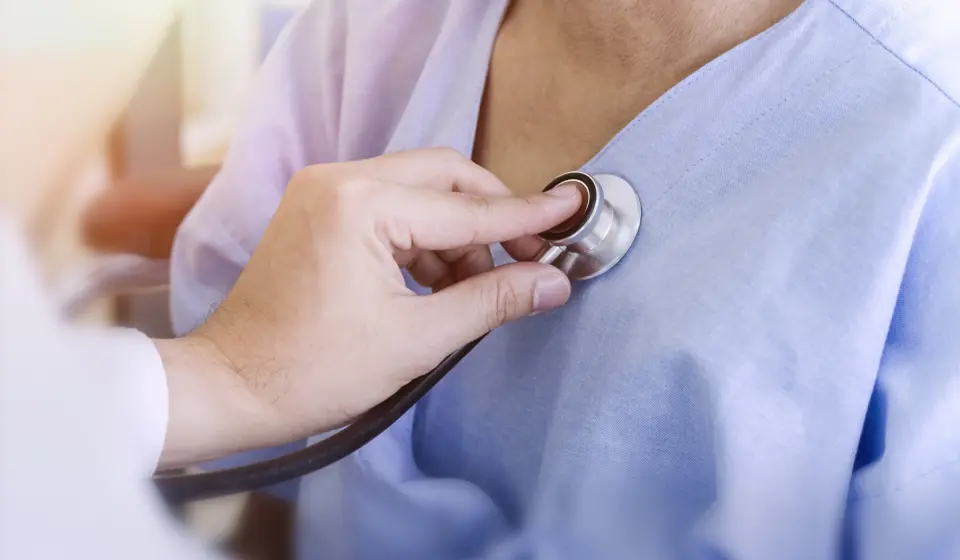 healthy-concept-doctor-checking-patient-s-heart-with-stethoscope-at-a-hospital-1063133736_4956x3324.jpeg